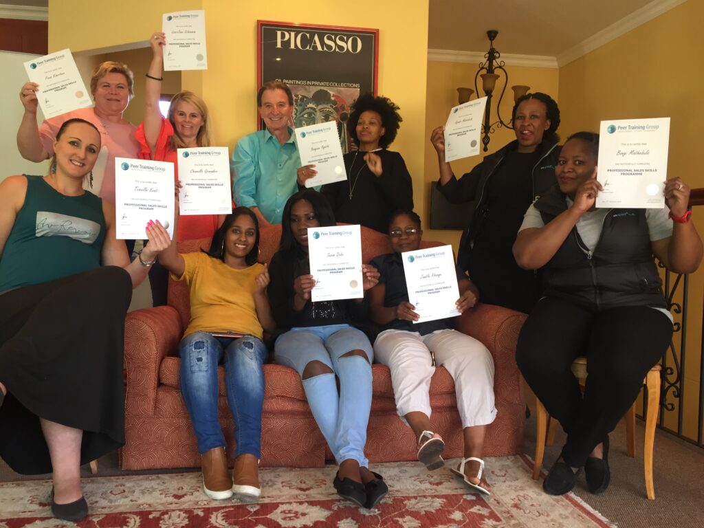 Clive Price with happy sales training delegates